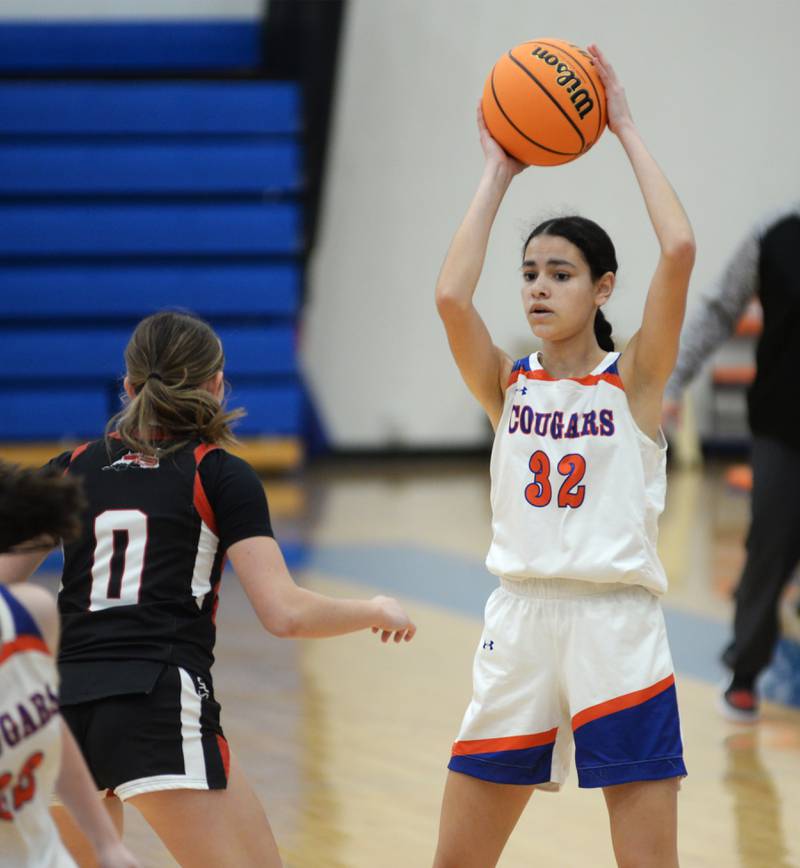 Eastland's Deyanise Nieves (32) looks to pass the ball against Fulton on Friday, Dec. 13, 2024 at Eastland High School in Lanark.