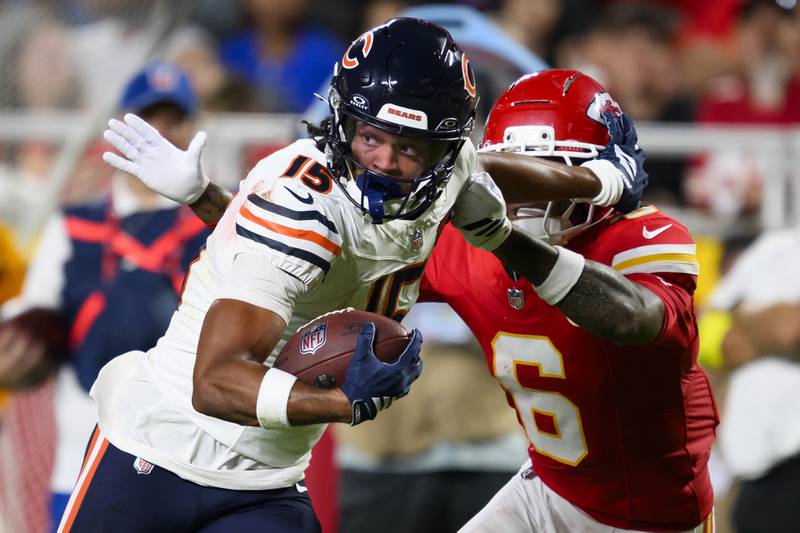 Chicago Bears wide receiver Rome Odunze (15) makes a catch and run against Kansas City Chiefs safety Bryan Cook (6) during the first half of an NFL preseason football game, Friday, Aug. 22, 2025 in Kansas City, Mo. The Bears defeated the Chiefs, 29-27. (AP Photo/Reed Hoffmann)
