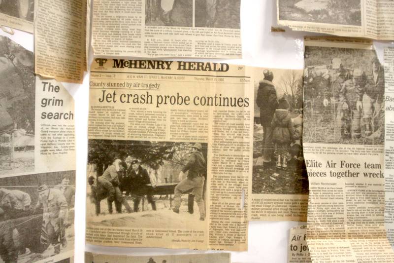 News clippings are displayed as a remembrance was held Saturday at Wonder Lake Fire Protection District Station 2 on the 40th anniversary of a midair military jet explosion that happened over the small, rural area northeast of Woodstock. The plane exploded midair at 9:11 p.m. on March 19, 1982, its flaming pieces raining over a 2-mile area near Greenwood. On board were more than two-dozen members of the Air Force Reserve and Air National Guard. Twenty-seven people died.