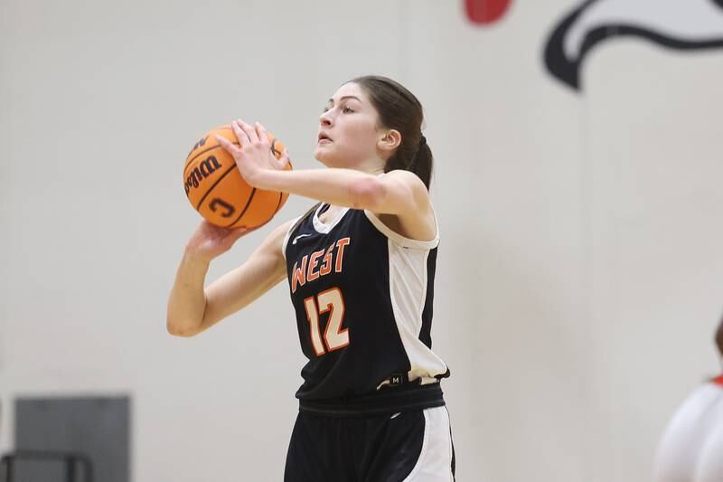 Lincoln-Way West’s Caroline Smith takes the deep shot against Lincoln-Way Central on Tuesday, Jan 28, 2025 in New Lenox.