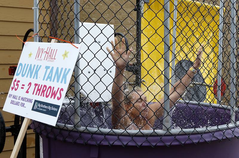 Miranda Alt hits the water while after being the dunk tank target during the Ice Cream Fest on Friday, Aug. 9, 2024, at Crystal Lake’s Main Beach.  The second annual event featured music, ice cream venders and an ice cream eating contest.