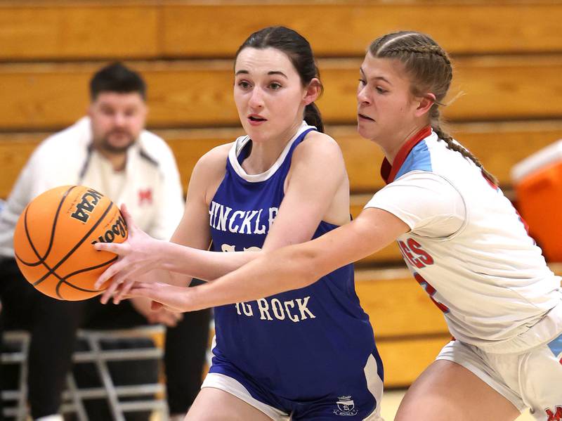 Hinckley-Big Rock's Mia Cotton tries to drive by Marian Central's Addie Leitzen Monday, Feb. 16, 2026, during their regional semifinal game at Hinckley-Big Rock High School.