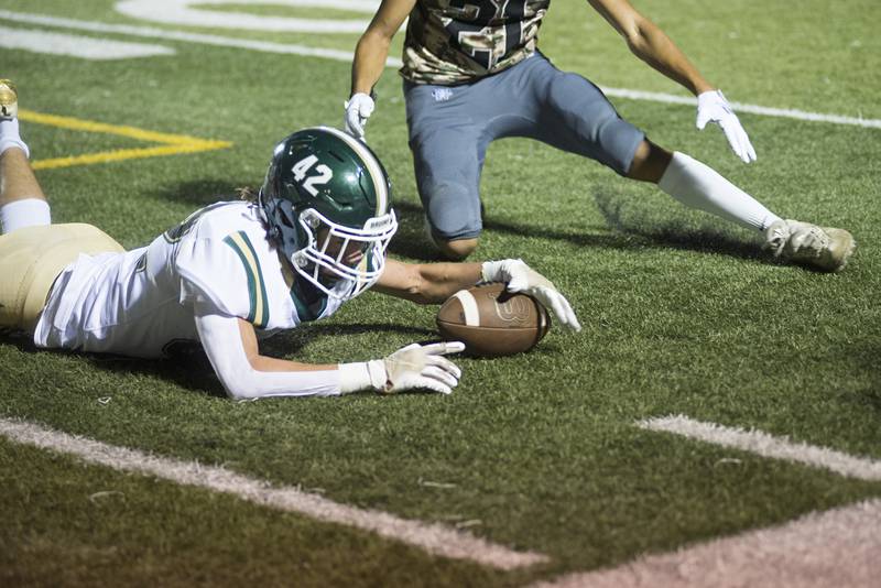 St. Bede’s Evan Entrican grabs a fumble against Newman Friday, Sept. 16, 2022.