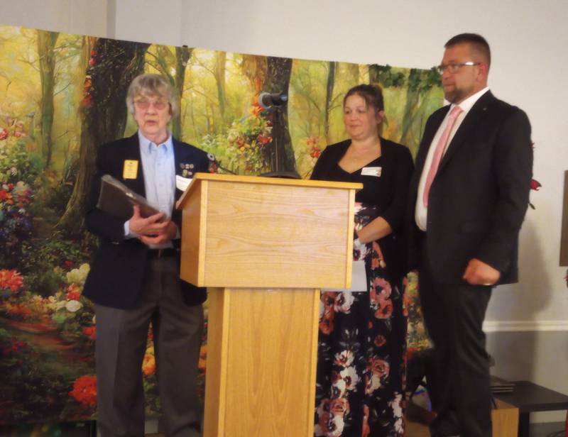 Nancy Rex (left) presents Tricia and Robin Kleckner with the 2024 Sandwich Lions Club Citizenship Award at the Sandwich Area Chamber of Commerce Annual Dinner.
