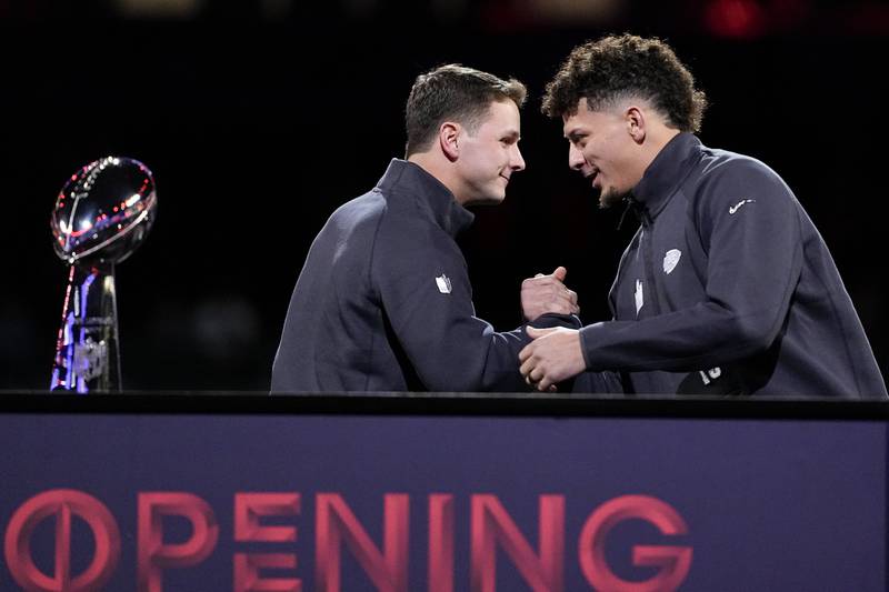 San Francisco 49ers quarterback Brock Purdy and Kansas City Chiefs quarterback Patrick Mahomes shake hands during Super Bowl 58 opening night Monday, Feb. 5, 2024, in Las Vegas. The San Francisco 49ers face the Kansas City Chiefs in Super Bowl 58 on Sunday.