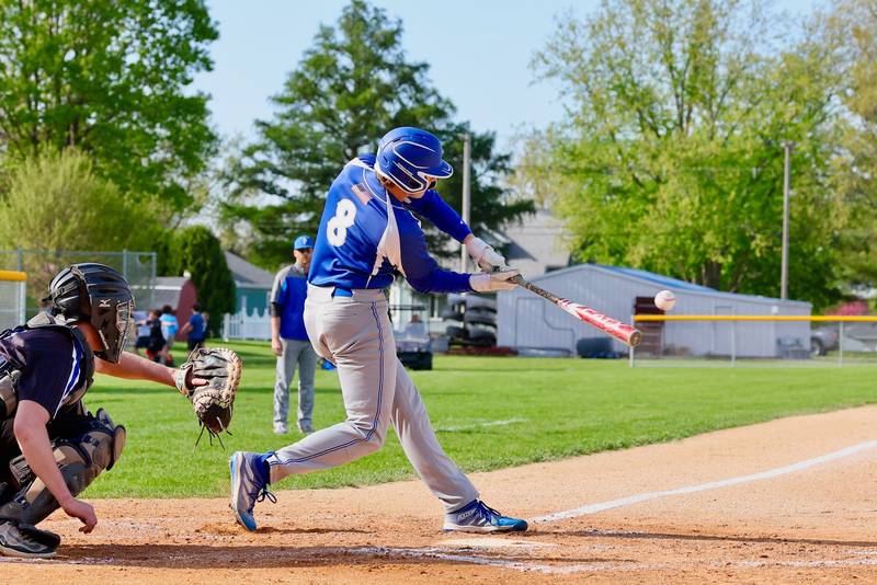 Princeton's Ryan Jagers connects against Newman Tuesday at Prather Field. The Comets won 3-2.