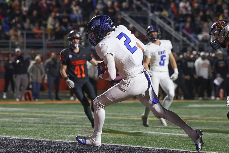 Lincoln-Way East’s Trey Zvonar spins into the end zone after a catch against Minooka on Friday, Nov. 8, 2024 in Minooka.