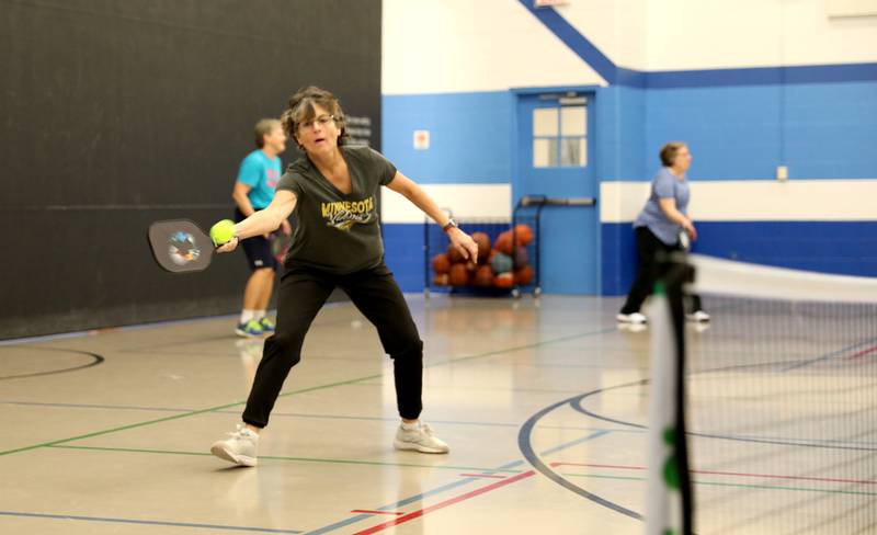 Chris Pawlak of Geneva reaches for the ball during a pickle ball open gym session at the Pottawatomie Community Center in St. Charles on Jan. 23, 2023.