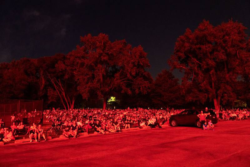 Spectators are illuminated by the “July 4th Fireworks” at Langum Park in St. Charles on Friday, July 4, 2025.
