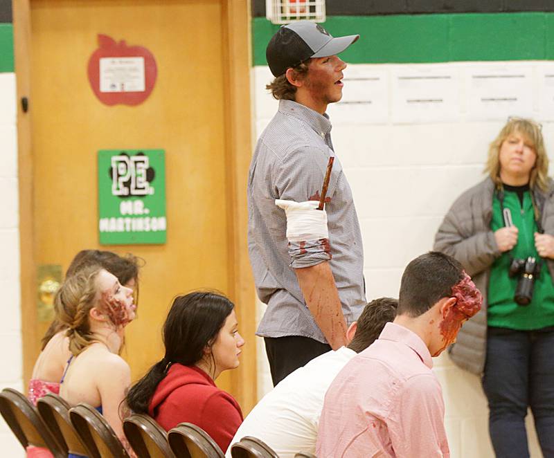 Porter Thrall a student at Leland High School, speaks to classmates on his experience after participating in a Mock Prom drill at Leland High School on Friday, May 6, 2022 in Leland.