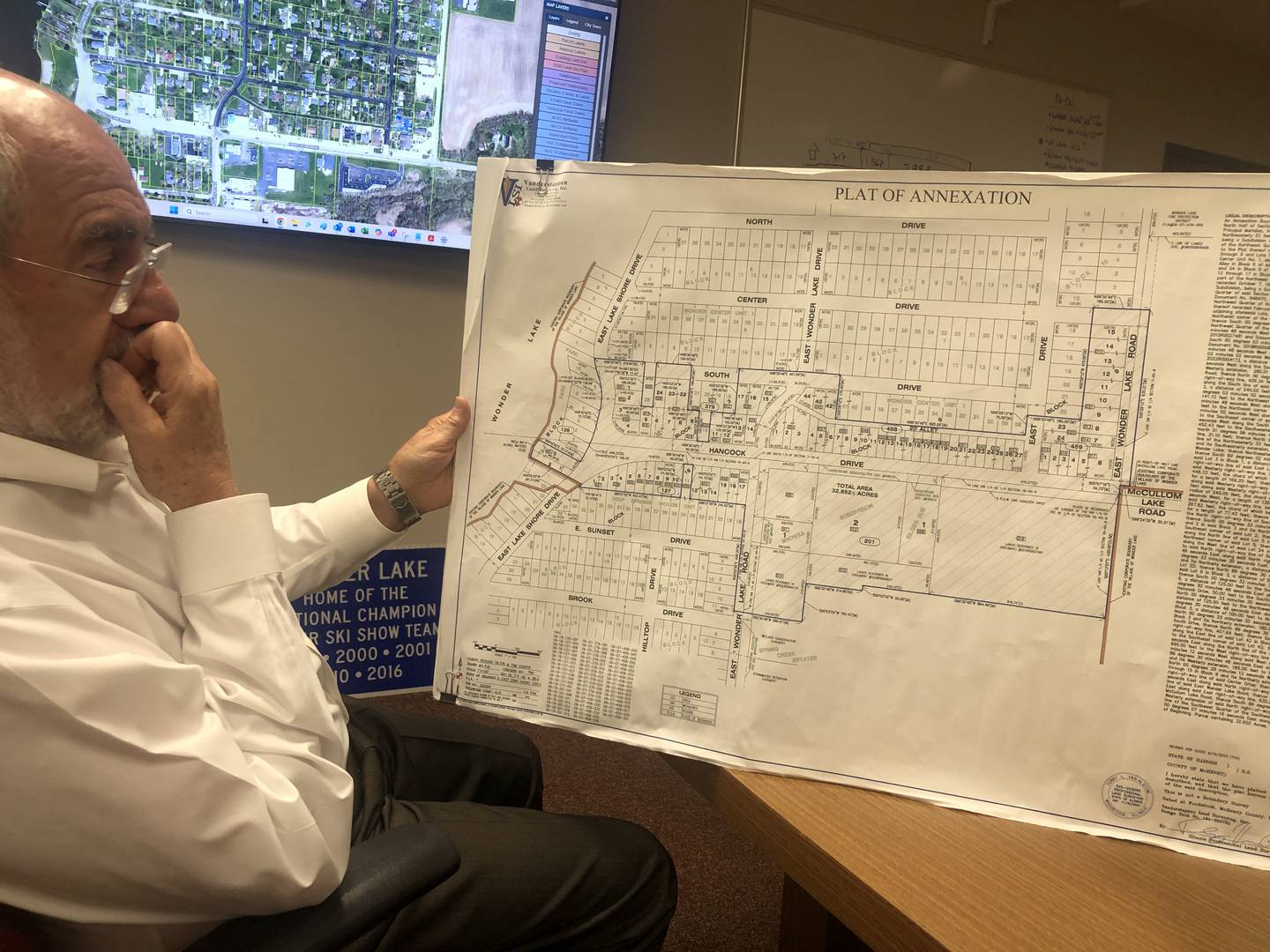 Wonder Lake Village Administrator William Beith describes on Wednesday, July 16, 2025 - the first day of construction - how contractors will connect Hancock Drive businesses to the village water and sewer system.
