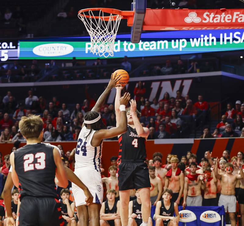 Benet's Ethan MacDermot (4) shoots over DePaul College Prep's Rashaun Porter (24) during the IHSA Class 4A boys basketball state semifinal Friday, March 13, 2026 at the State Farm Center in Champaign.