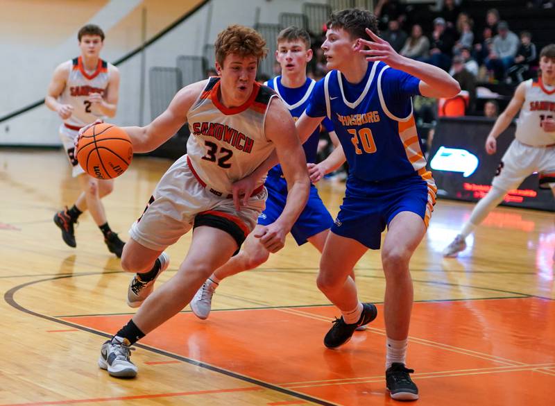 Sandwich’s Quinn Rome (32) plays the ball in the post against Johnsburg's Joshua Kaunas (20) during a basketball game at Sandwich High School on Friday, January 31, 2025.