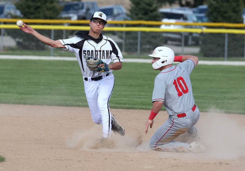 Ottawa's Jace Veith is forced out at second by Sycamore's Sawyer Valdez who turns a double play during their game Tuesday, May 6, 2025, at the Sycamore Community Sports Complex.