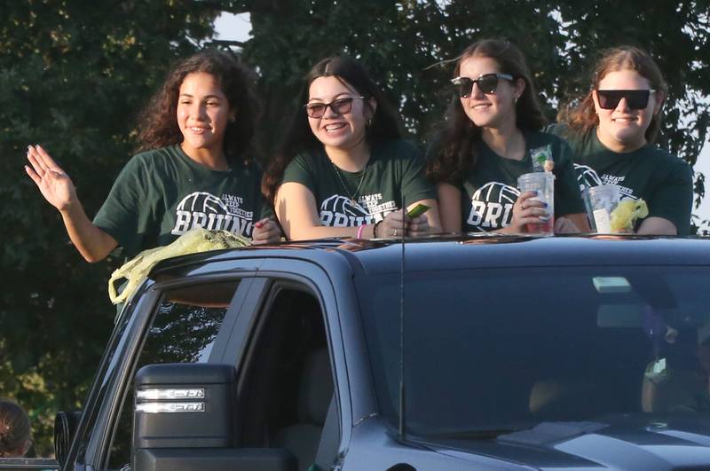 Members of the St. Bede volleyball team ride in the St. Bede Homecoming Parade on Friday, Sept. 29, 2023 at St. Bede Lane.