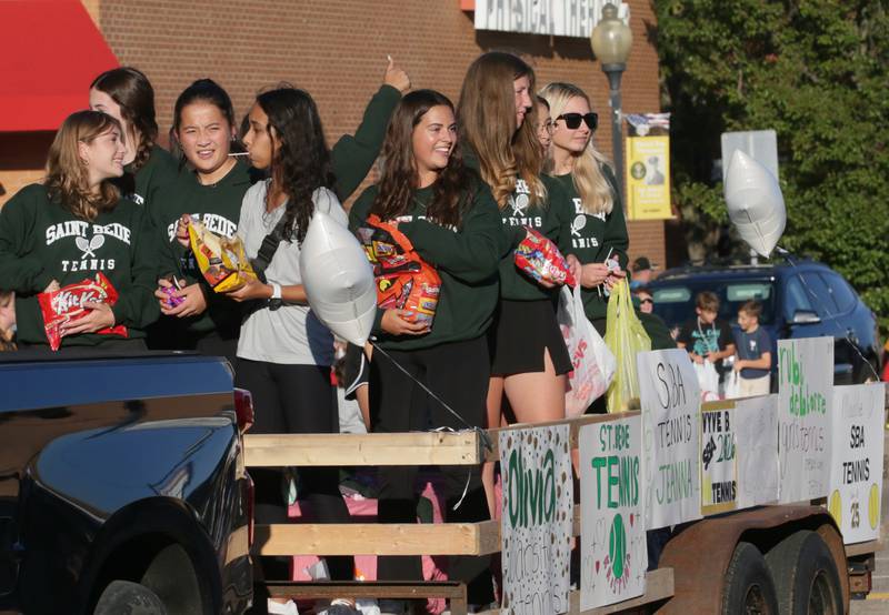 St. Bede tennis players ride in the Homecoming parade on Friday, Sept. 30, 2022 downtown Peru.
