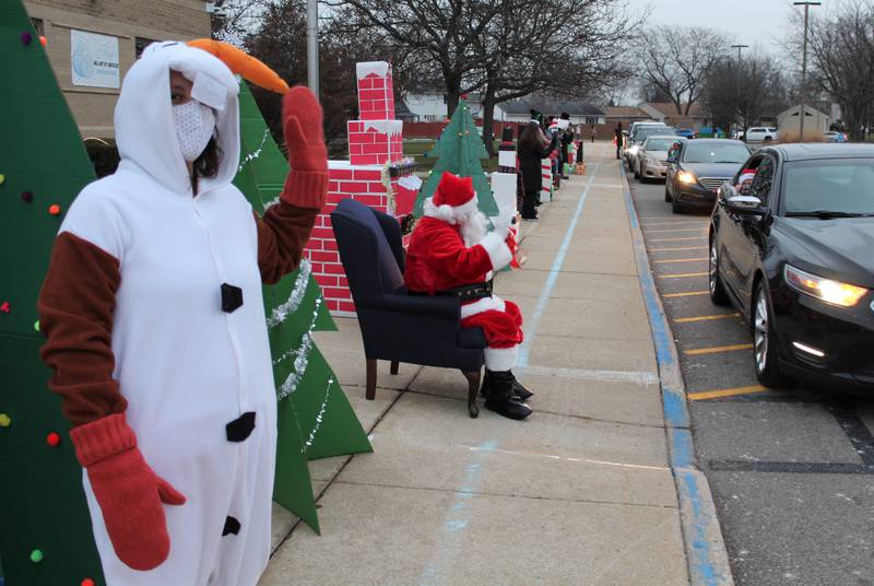 Santa visited Troy 30-C schools in December, including Troy Heritage Trail Elementary School, where families drove past him to exchange holiday greetings.