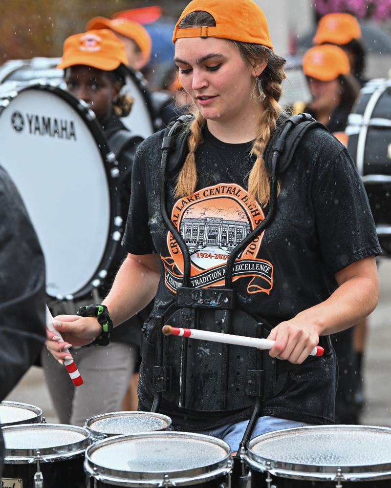 Members of the Crystal Lake Central High School's  Marching Tiger Band seen in downtown Crystal Lake during their school's 100 year anniversary homecoming day parade on Saturday, Sep. 16, 2023 in Crystal Lake. The parade began at the high school and made its way through downtown Crystal Lake.