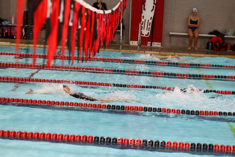 Bradley-Bourbonnais' Abby Bonilla leads in the 100-yard backstroke during Bradley-Bourbonnais' victory over Kankakee and Bishop McNamara in the All-City swim meet on Tuesday, Sept. 9, 2025.