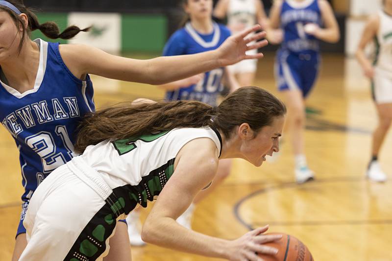 Rock Falls’ Brooke Howard is fouled going to the hoop against Newman’s Madison Duhon Thursday, Nov.17, 2022.