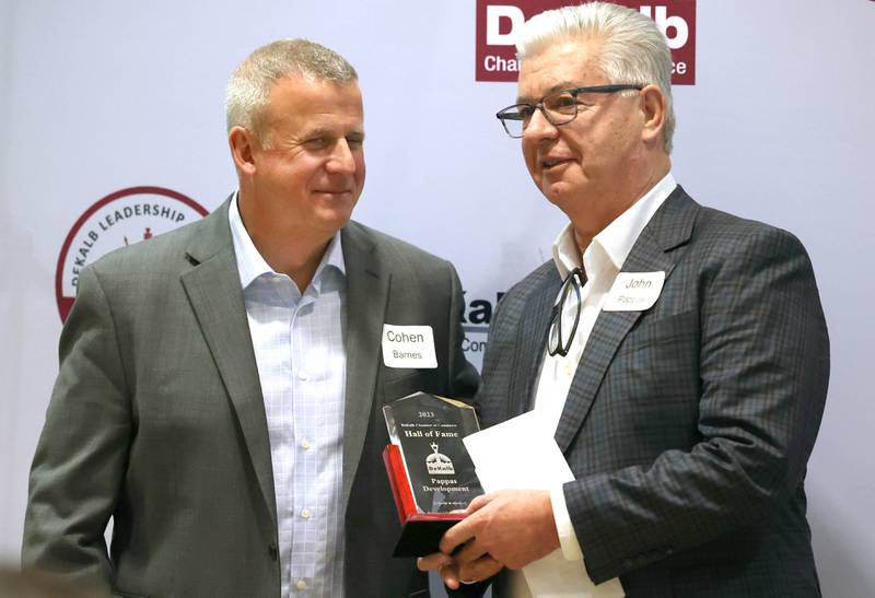 DeKalb Mayor Cohen Barnes presents John Pappas with his award for being inducted into the Business Leaders Hall of Fame Thursday, Feb. 9, 2023, during the DeKalb Chamber of Commerce’s Annual Celebration Dinner in the Barsema Alumni and Visitors Center at Northern Illinois University.