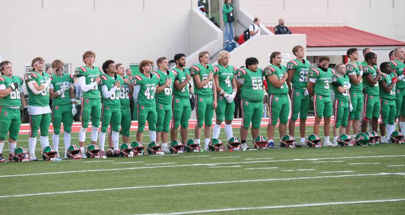 Members of the L-P football team stand for the National Anthem before playing Metamora on Friday, Sept. 5, 2025 at Howard Fellows Stadium.