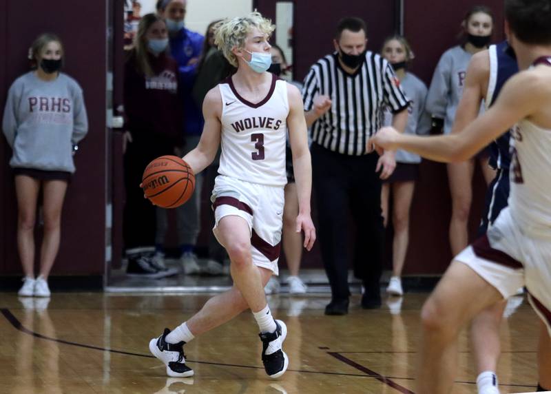 Prairie Ridge’s Zachary Lindquist looks for an option against Cary-Grove during boys varsity basketball action in Crystal Lake Tuesday night.