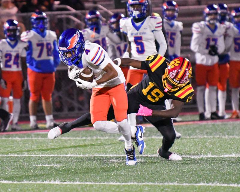 Batavia's Sai'mar Howell (19) trips up Hoffman Estates's Brandon Smith (4) during the first round of playoffs on Friday Oct. 31, 2025, held at Batavia High School.
