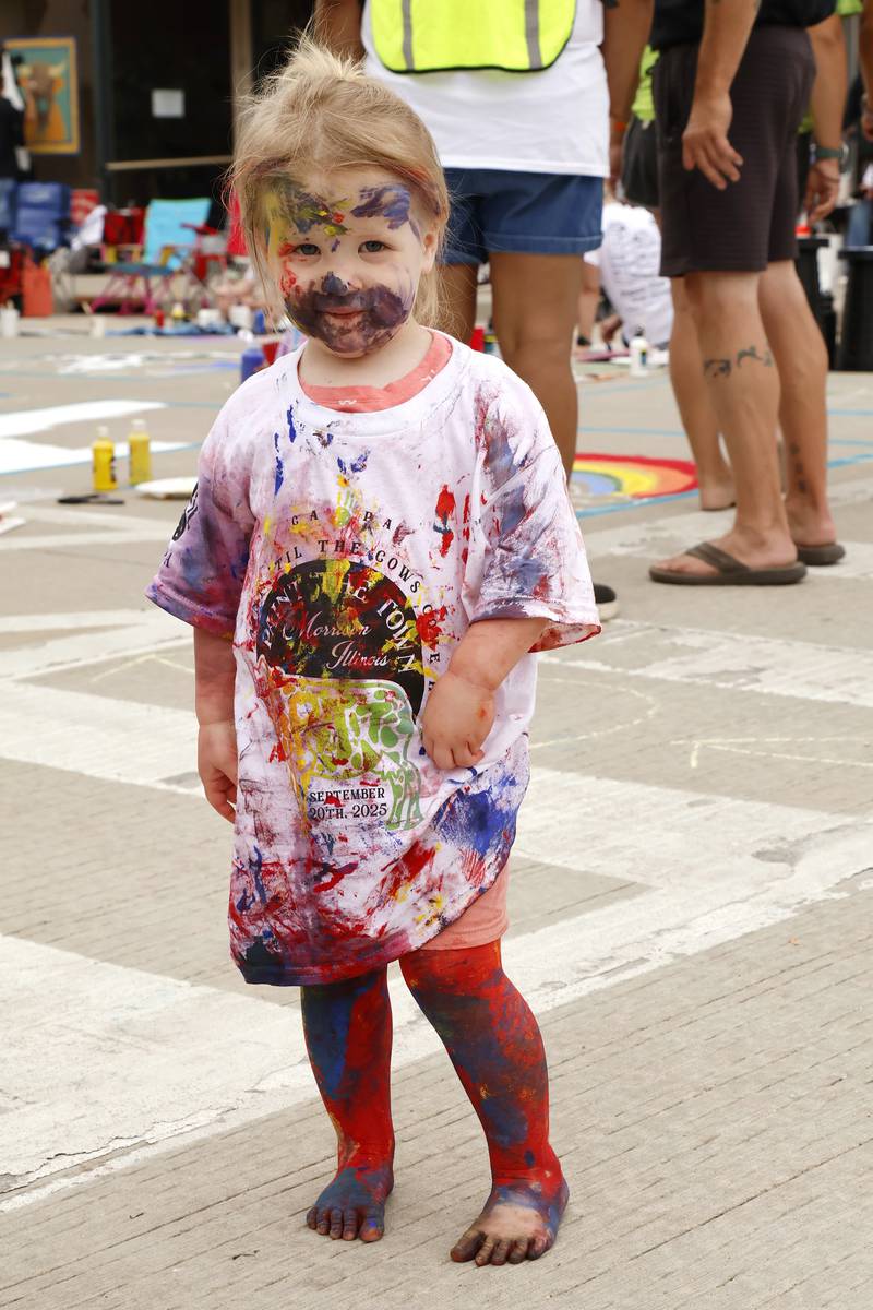 Evelyn Whitcombe, 2, of Dixon showed the streets weren't the only canvas on Saturday, Sept. 20, 2025, in Morrison. The town held its annual Paint the Town event, bringing in thousands of people to show off their creative sides by painting squares on Main Street, or in Evelyn's case, herself.