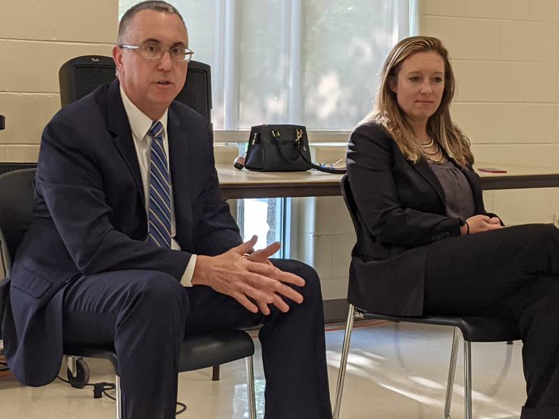 Kendall County State’s Attorney Eric Weis, left, and Kane County State’s Attorney Jamie Mosser, right, spoke Thursday at a forum at the Eola Community Center in Aurora.