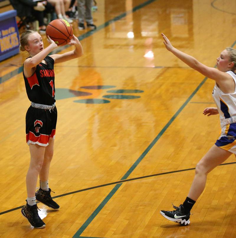 Sandwich's Julia Meyers (1) shoots a shot over Somonauk's Macey Kinney (34) in the Tim Humes Breakout Tournament on Friday, Nov. 18, 2022 in Somonauk.