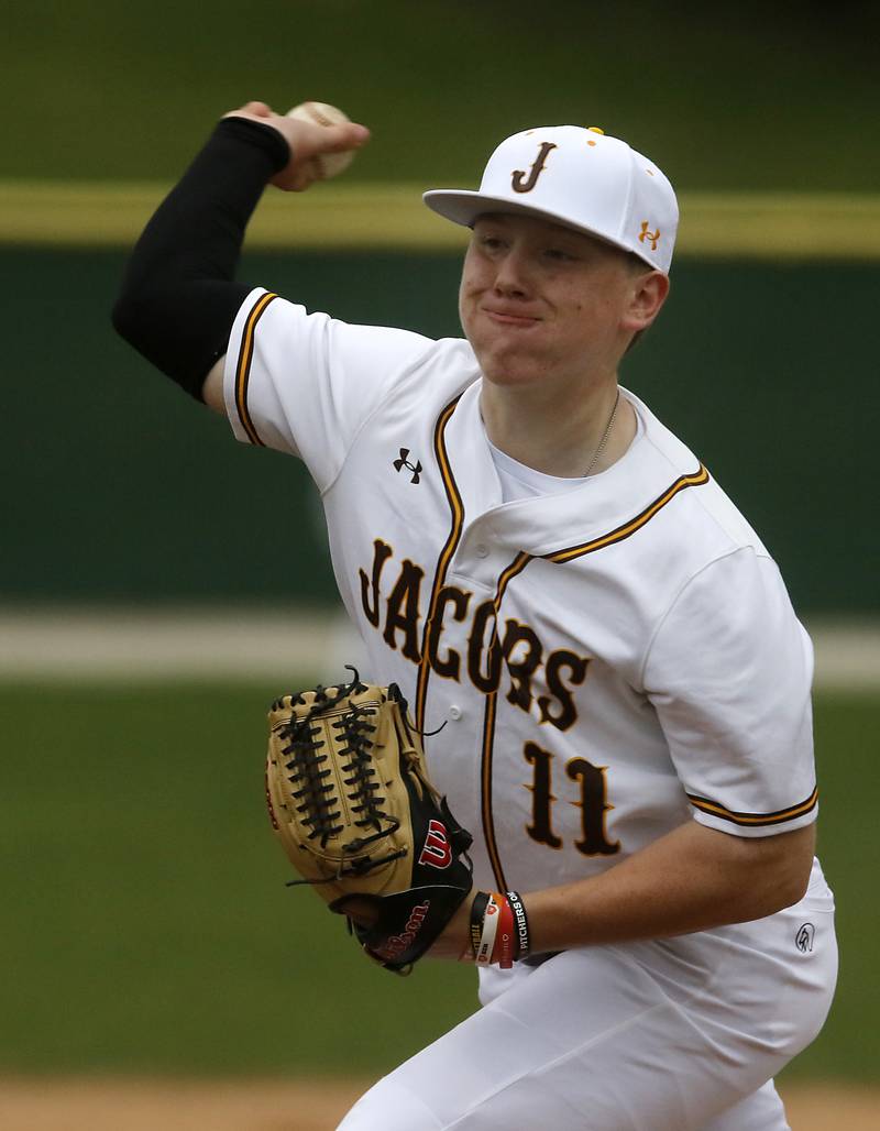 Jacobs' Braden Behrens throws pitch during a Fox Valley Conference baseball game against Cary-Grove on Wednesday, April 17, 2024, at Cary-Grove High School. The game was stopped for darkness after the 9th inning with the score tied 6-6.