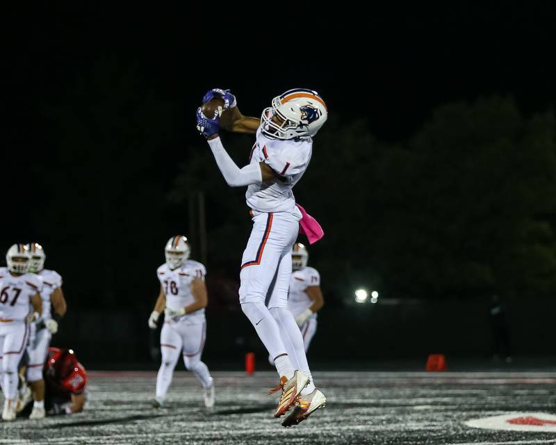 Oswego's Jeremiah Cain (1) makes a catch during a football game between Oswego at Bolingbrook on Friday, Oct 4th, 2024  in Bolingbrook.