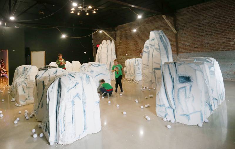 Kids have an indoor snow ball fight during the Miracle on First Street at Ax Church on Saturday, Dec. 6, 2025 in La Salle.