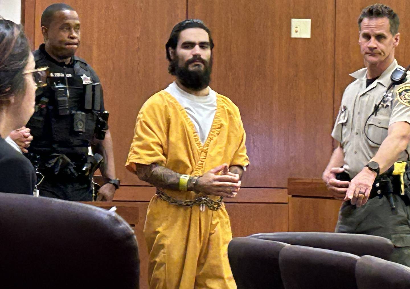 Jonathon Gounaris is escorted into an Ogle County courtroom on Monday, July 22, 2024. He is charged with the attempted murder of three police officers following a standoff at his home near Dixon.