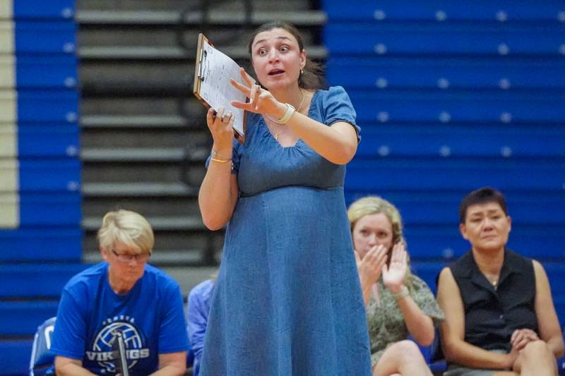 Geneva’s head coach Lauren Kosecki gives instructions to her players during a DuKane Conference match against Wheaton Warrenville South in Geneva on Tuesday, Sept. 16, 2025.