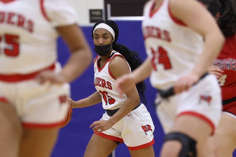 Bolingbrook’s Kendall Winston works the ball up court against Eisenhower in the Class 4A Lincoln-Way East Regional semifinal. Monday, Feb. 14, 2022, in Frankfort.