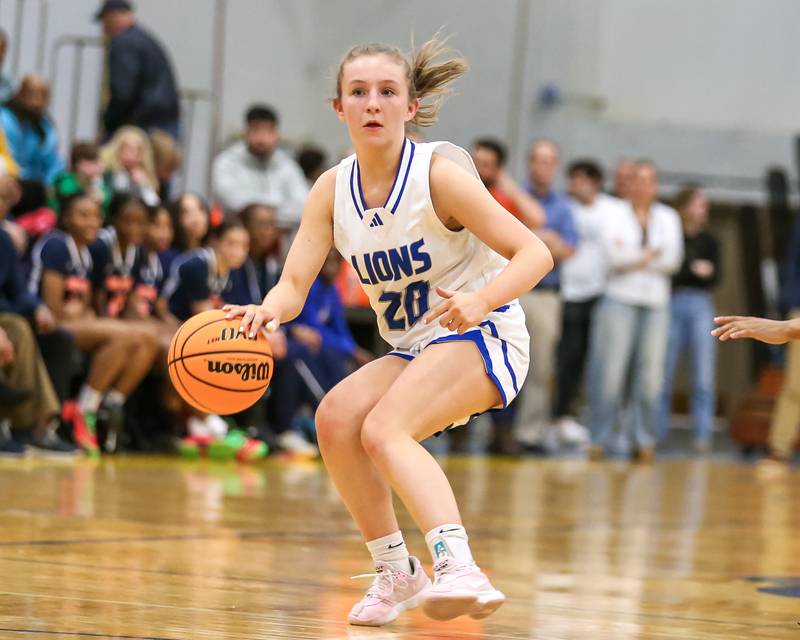 Lyon's Avery Mezan (20) looks to pass during their Class 4A Lyons Sectional semifinal basketball game between Lyons vs Young. Feb 25, 2025 in La Grange.