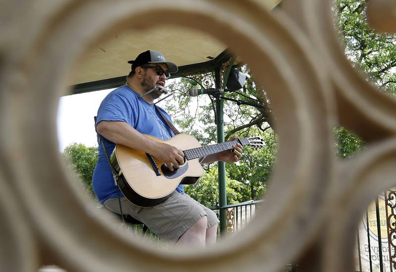 Pierce Crask of Skokie performs at the Tuesday Woodstock Farmer's Market on June 24, 2025, around the Historic Woodstock Square.