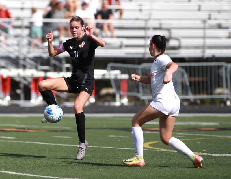 Wheaton Warrenville South's Ella Byrnes kicks the ball during a game against St. Charles East on Friday, May 16, 2025 in Wheaton.