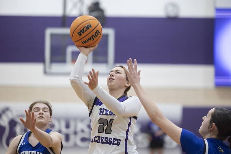 Dixon’s Reese Dambman works below the basket against Geneva Thursday, Feb. 19, 2026, in the Class 3A girls basketball regional title game.