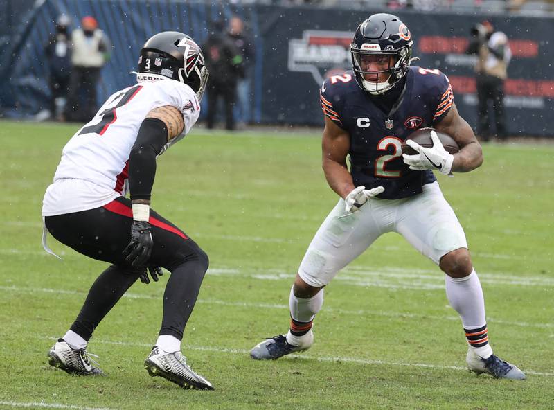 Chicago Bears wide receiver DJ Moore looks to get by Atlanta Falcons safety Jessie Bates III during their game Sunday, Dec. 31, 2023, at Soldier Field in Chicago.