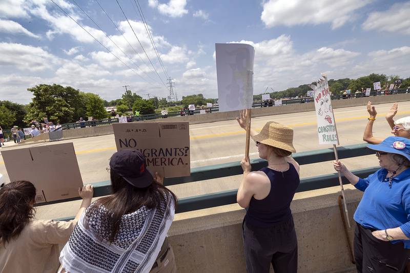 Protesters in Dixon join a nationwide No Kings protest Saturday, June 14, 2025. The anti-Trump gathering lined both sides of the Peoria Avenue Bridge.