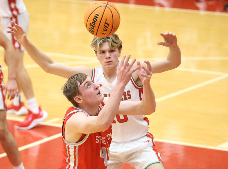 Streator's Nolan Lukach looses control of the ball under the hoop as L-P's Braylin Bond defends during the Dean Riley Shootin' The Rock Thanksgiving Tournament on Monday, Nov. 25, 2024 in Kingman Gym at Ottawa High School.