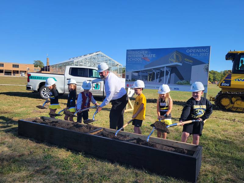 Herscher Intermediate School Principal Brett Miller participates in a groundbreaking ceremony for the new HIS building with some of its future students on Thursday, Oct. 9, 2025.