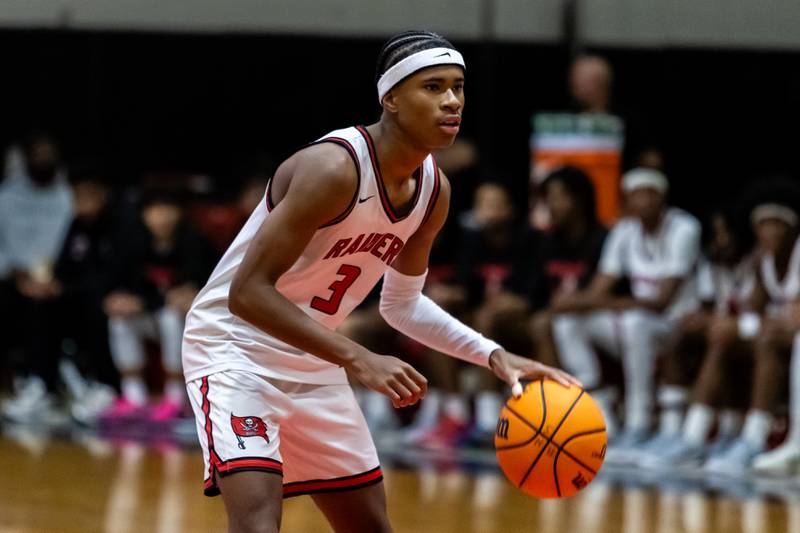 Bolingbrook's TJ Williams waits for a play to develop during a varsity boys basketball game against Oswego East at Bolingbrook on Dec. 12, 2025.