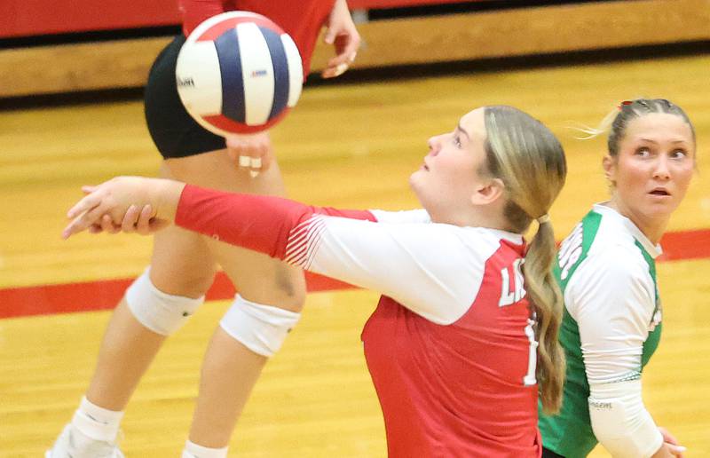 L-P's Emma Jereb hits the ball as teammate Karmen Piano gets in position during the Class 3A Sectional final game on Thursday, Nov. 6, 2025 in Sellett Gymnasium at L-P High School.