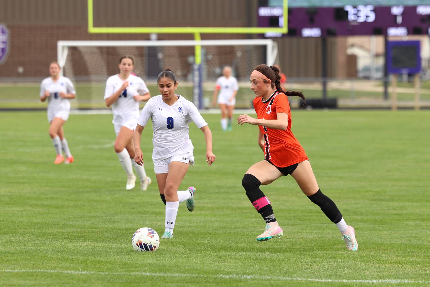 Beecher's Grace Durante makes an offensive run against Peotone's Nayeli Horta (9) during Peotone's 2-1 victory over Beecher in the Class 1A Manteno Regional championship on Friday, May 22, 2026.