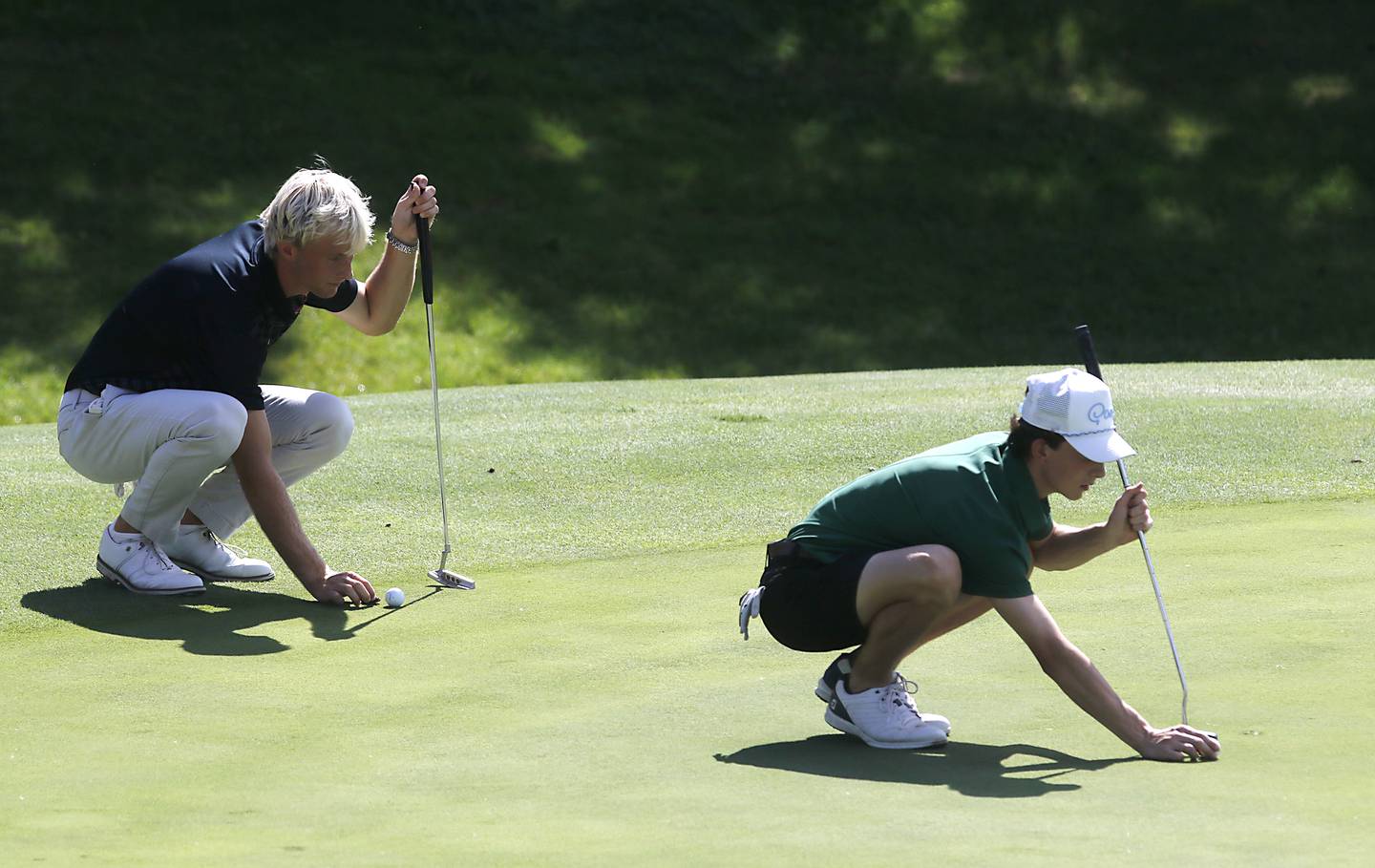 McHenry’s Dane Currie and Crystal Lake South’s Zach Schuster line up their putts on the 8th green during the Fox Valley Conference Boys Golf Tournament Thursday, Sept. 25, 2025, at Foxford Hills Golf Club in Cary.
