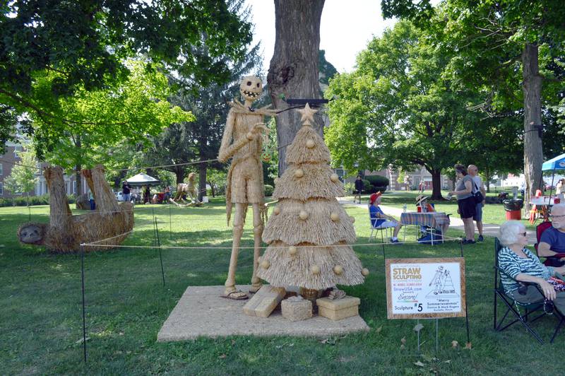 "Merry Summerweenmas," by Danica and Mark Rogers, of Rochelle, on Saturday Aug. 24, 2024, sits on the Mt. Morris College Campus in the village's downtown. The straw sculpture was an entry in the ninth annual U.S. National Straw Sculpting Competition and won first place for People's Choice and tied for second place for Artists' Choice.